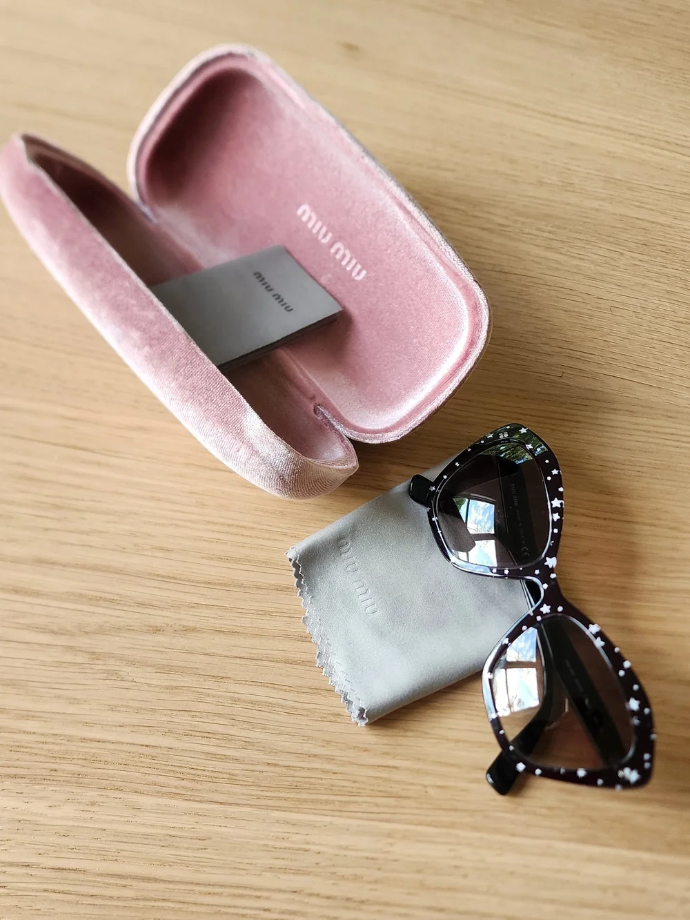 Miu Miu Women's Cat-Eye Black Sunglasses With White Star Pattern